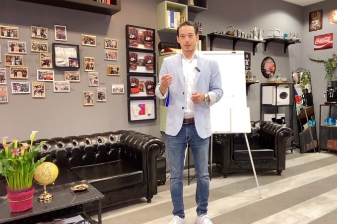 Nicholas Sebastian Chan giving retail customer service and sales training